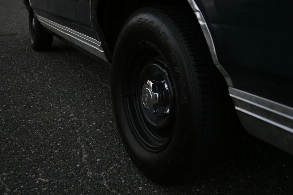 Dark sedan wheel and chrome trim