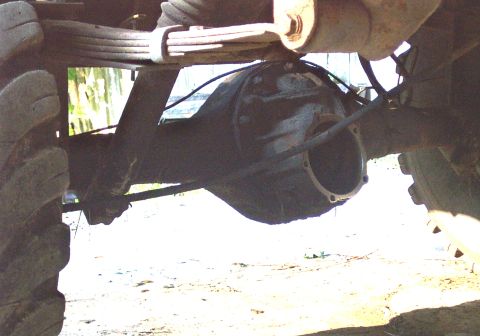1978 Ford Bronco - Close-up view of a vehicle's rear axle and leaf springs, with a Supermotors.net watermark visible at the bottom.