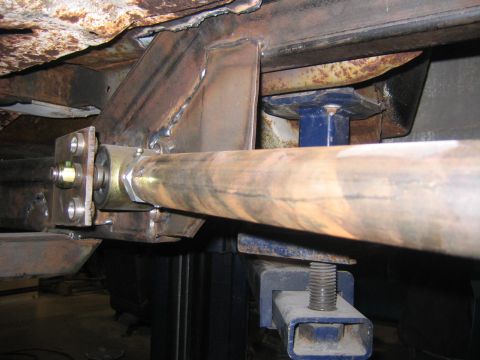 1982 Ford Bronco - Custom suspension part with visible welds and rust, likely a modification to a vehicle's undercarriage.