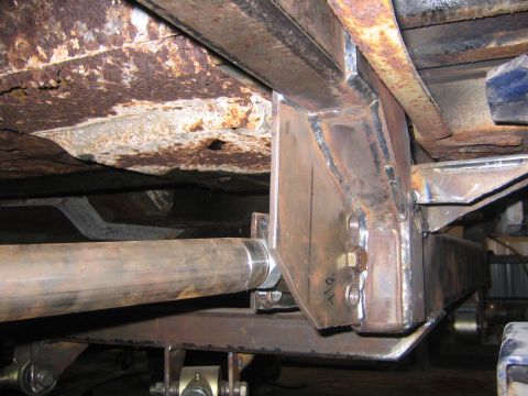 1982 Ford Bronco - Custom suspension fabrication work is visible on the underside of a vehicle.