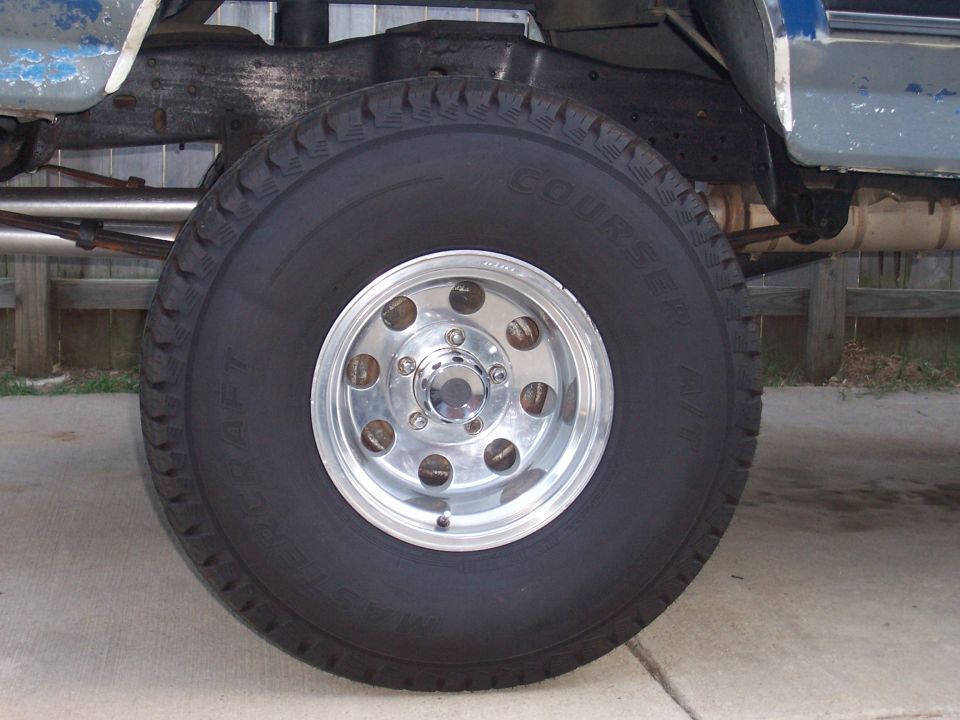 Close-up of a 1988 Ford Pickup's front wheel and suspension