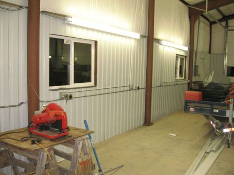 1986 Ford Ranger - Interior view of a workshop with tools and a trailer visible.