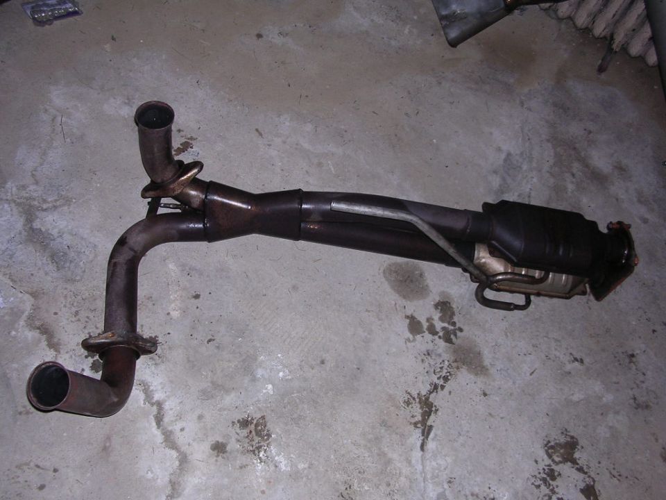 Exhaust pipe assembly with catalytic converter, showing two inlet pipes and one outlet pipe