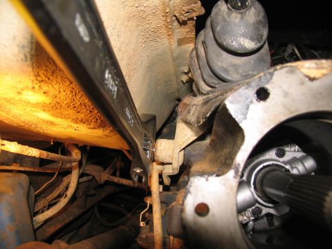 1978 Ford Bronco - Adjustable wrench used during transmission removal process.