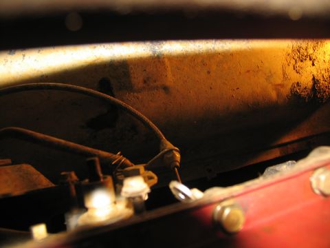 1978 Ford Bronco - Close-up of mechanical components under a vehicle, possibly related to transmission removal.