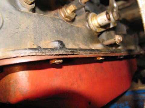 1978 Ford Bronco - Close-up view of an engine oil pan and its connection to the engine block.