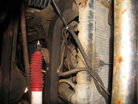 1978 Ford Bronco - Underside view of engine bay components, including the radiator, belts, and suspension parts.