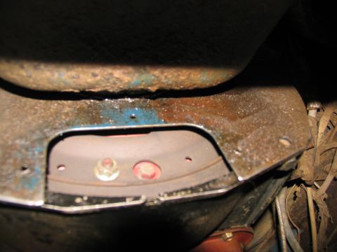 1978 Ford Bronco - Close-up of rusty undercarriage parts, likely related to transmission removal.