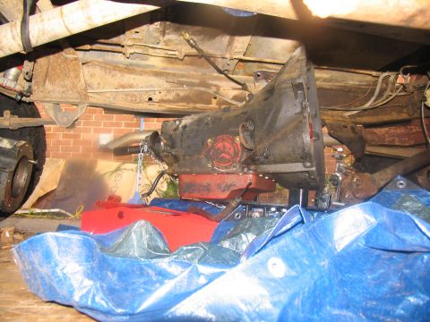 1978 Ford Bronco - Underside view of a 1978 Ford Bronco with the transmission partially removed for service.