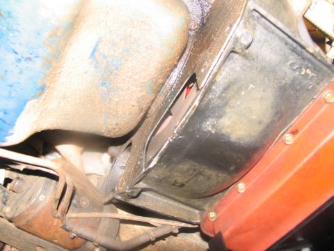 1978 Ford Bronco - Underside view of engine components, focusing on the oil pan and transmission housing.