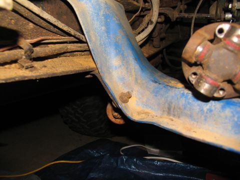 1978 Ford Bronco - Underside view of a vehicle's frame and drivetrain components, including a driveshaft yoke.