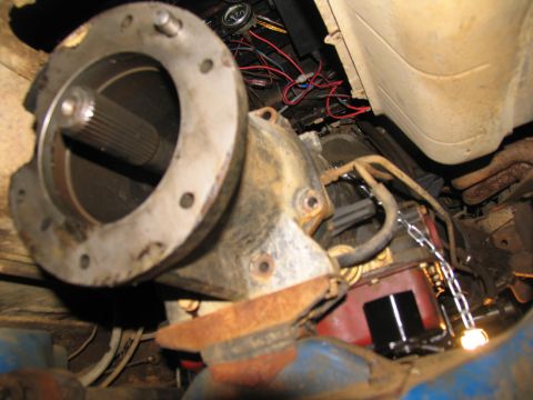 1978 Ford Bronco - Underside view of a vehicle's transmission and driveshaft, showing mechanical components and wiring.