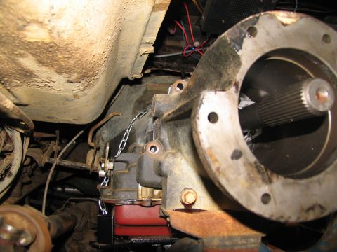 1978 Ford Bronco - The transmission and driveshaft are visible, with a chain securing the transmission during removal.
