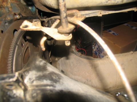 1978 Ford Bronco - Underside view of a vehicle's transmission area, showing mechanical components and wiring.