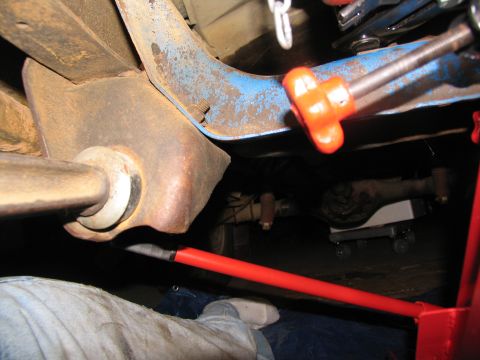 1978 Ford Bronco - Close-up view of a vehicle's undercarriage, showing suspension components and a rear axle assembly.