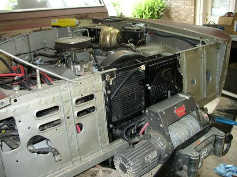 1995 Ford Bronco - The engine bay of a 1995 Ford Bronco shows a winch and radiator assembly.