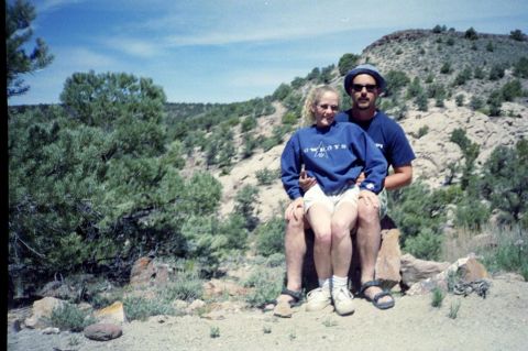 1982 Ford Customline - Couple poses for a photo in a natural outdoor setting with hills and trees.
