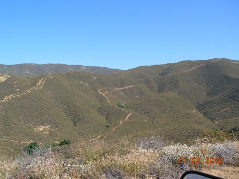 1985 Ford Bronco - A remote mountain scene with a winding dirt road, captured on July 8, 2006.