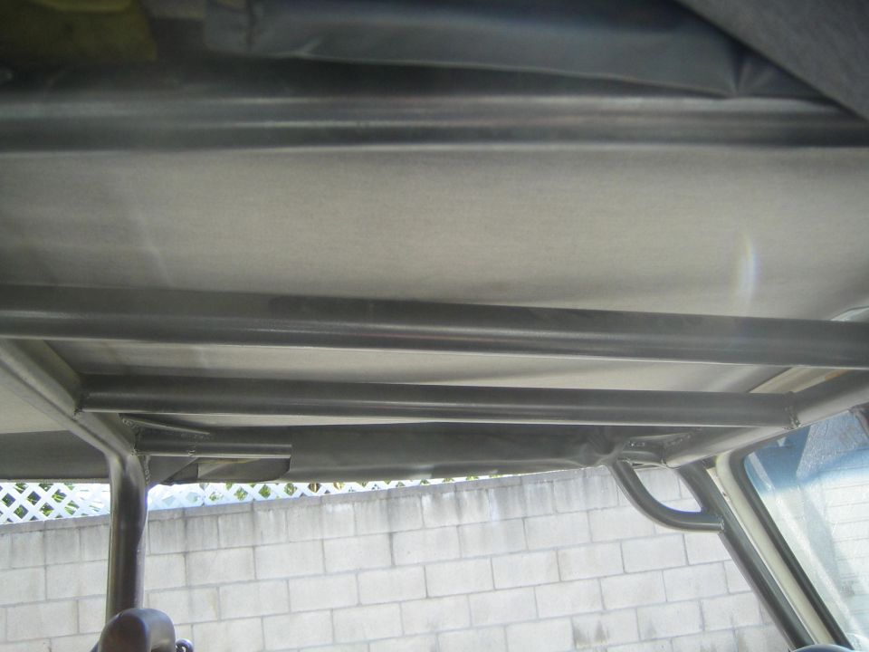 Interior view of a roll cage with fabric headliner