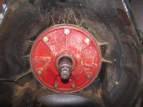 1978 Ford Bronco - Close-up view of a transmission bell housing, showing the red input shaft flange and splined shaft.