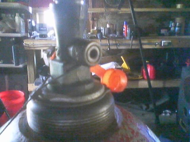 Close-up of welding equipment with an orange handle