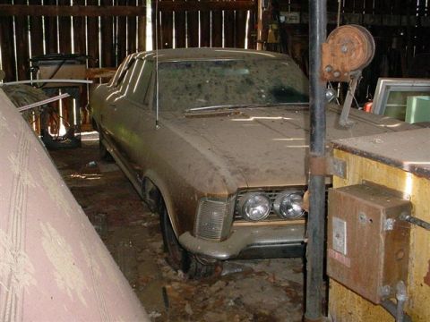 1972 Ford Ranchero - Dusty 1972 Ford Ranchero sits in a barn, awaiting restoration.