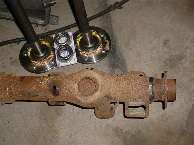 Rear axle assembly with axle shafts and bearings