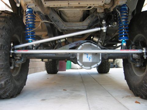 1997 Ford Ranger - Custom rear axle setup with aftermarket shocks and steering components visible.