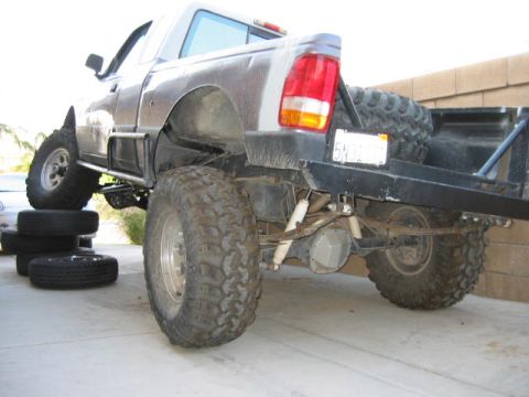 1997 Ford Ranger - This modified 1997 Ford Ranger features a lifted suspension, oversized off-road tires, and a custom flatbed, suggesting it's built for terr…