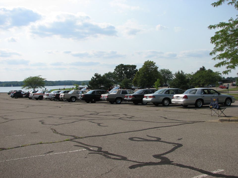 Silver 2003 Ford Crown Victoria parked in a line of sedans