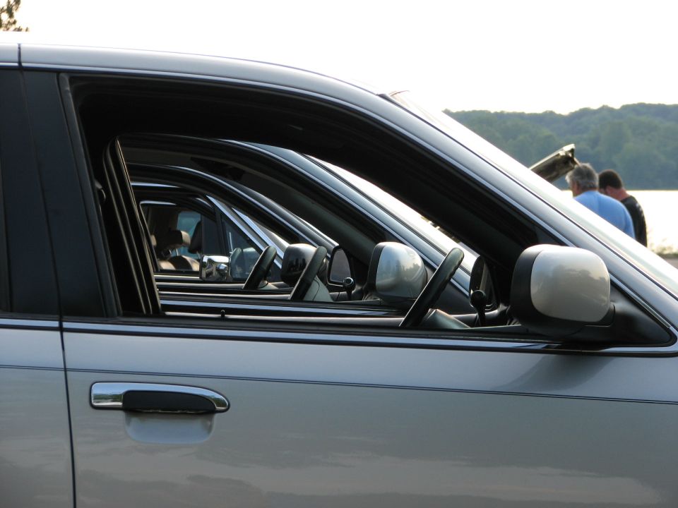 Side view of silver 2003 Ford Crown Victoria sedans parked in a row