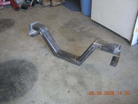 1996 Ford Bronco - Custom metal part fabricated from steel tubing, shown on a workshop floor.