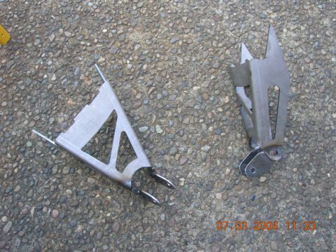 1996 Ford Bronco - Two custom metal suspension components are shown resting on a gravel surface, with a timestamp visible in the lower right corner.