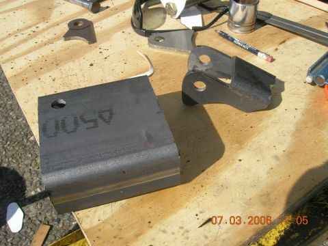 1996 Ford Bronco - Metal parts and a stamped metal plate are laid out on a wooden surface, with a date stamp of 07.03.2006.