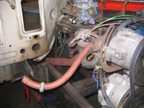 1982 Ford Bronco - Close-up view of a vehicle's engine bay, showing various mechanical components and wiring.