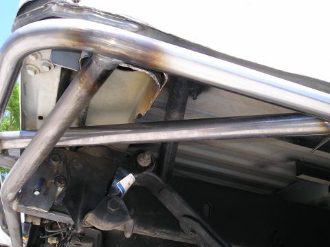 1993 Ford Bronco - This photo shows the underside of a vehicle with a custom roll cage and suspension components, not a 1993 Ford Bronco.