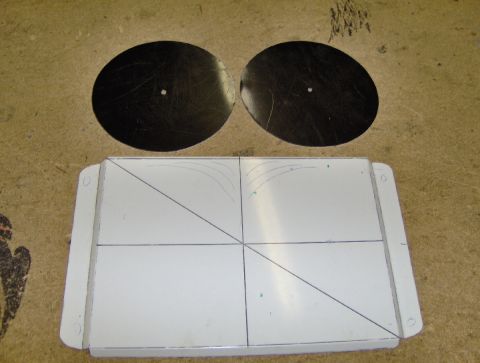 1978 Ford Bronco - Two black circular fans are positioned above a white rectangular part marked with grid lines.