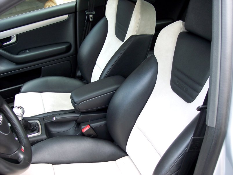 Black and white two-tone sport seats and manual shifter inside a 2004 Audi S4