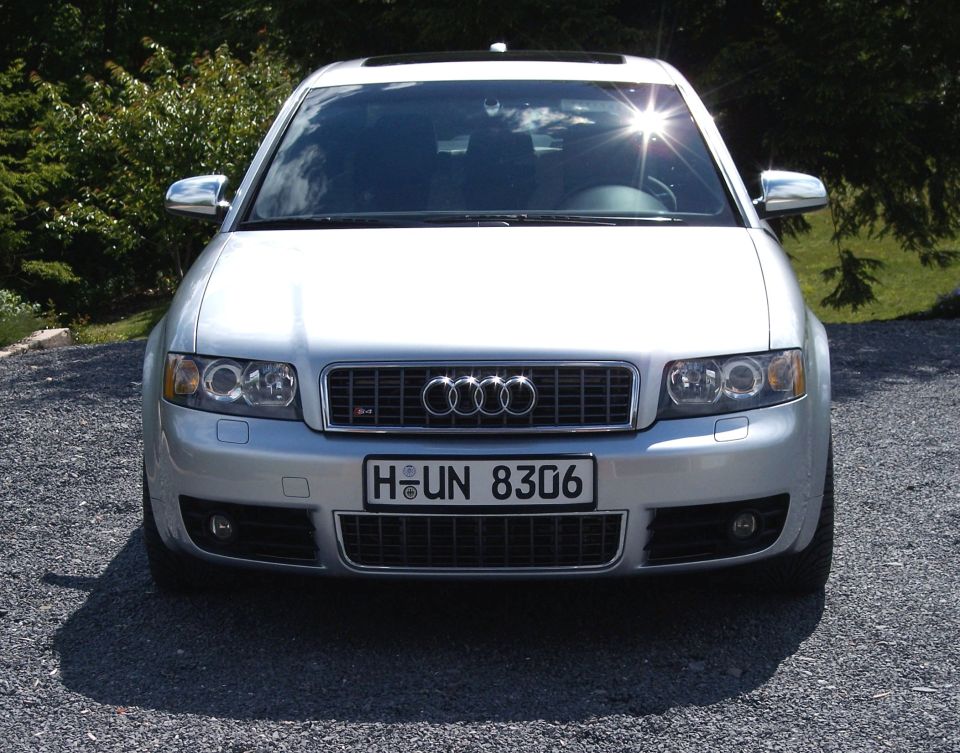 Front view of a silver Audi S4 sedan on gravel with German plate H-UN 8306