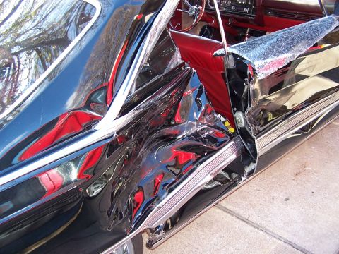 1966 Mercury Monterey - This 1966 Mercury Monterey shows extensive damage to its driver's side, with the door and fender heavily impacted. The red interior is visi…