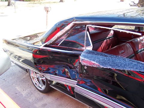1966 Mercury Monterey - This black sedan has extensive damage to its rear passenger side quarter panel and door.