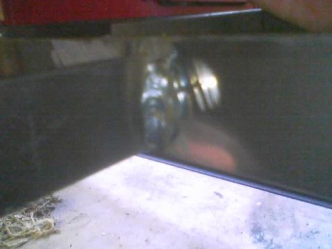 1989 Ford Bronco - Detail of welding work on a dark metal component, possibly part of a vehicle repair.
