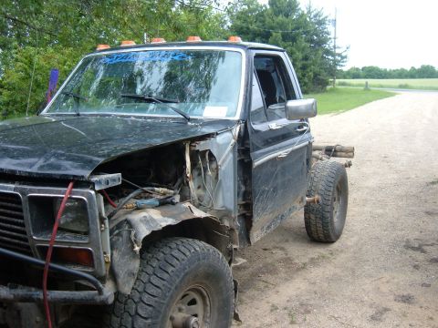 1985 Ford F-150 - This truck cab appears to be from the early 1980s, possibly a Ford F-Series, with significant front-end damage.