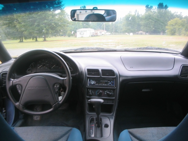 Ford Probe gray interior from rear seat: steering wheel, gauges, CD deck, automatic shifter