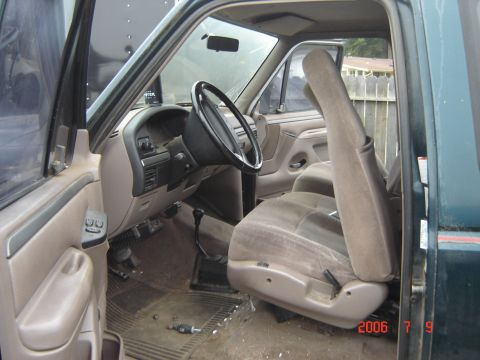 1993 Ford Bronco - Interior view of a green truck, likely a Ford F-Series or Bronco from the early 1990s.