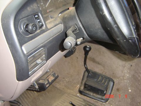 1993 Ford Bronco - Interior view showing the manual transmission shifter and dashboard controls.