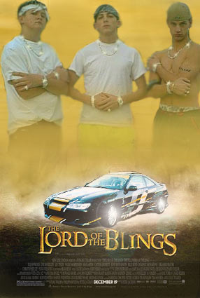 1977 Ford Mustang II - Poster for 'The Lord of the Blings' features three men and a car with text and website at the bottom.