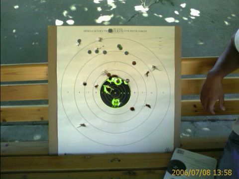 1990 Ford Bronco - A target shows the results of shooting practice, with numerous impacts around the bullseye.