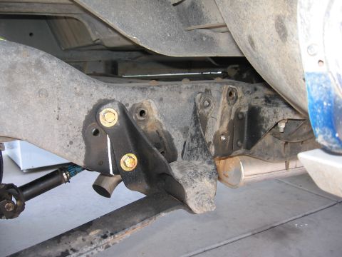 1990 Ford Bronco - pass. side front spring hanger, relocated 3 inches to the rear