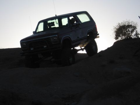 1990 Ford Bronco - This 1990 Ford Bronco is captured mid-climb on a steep dirt incline.